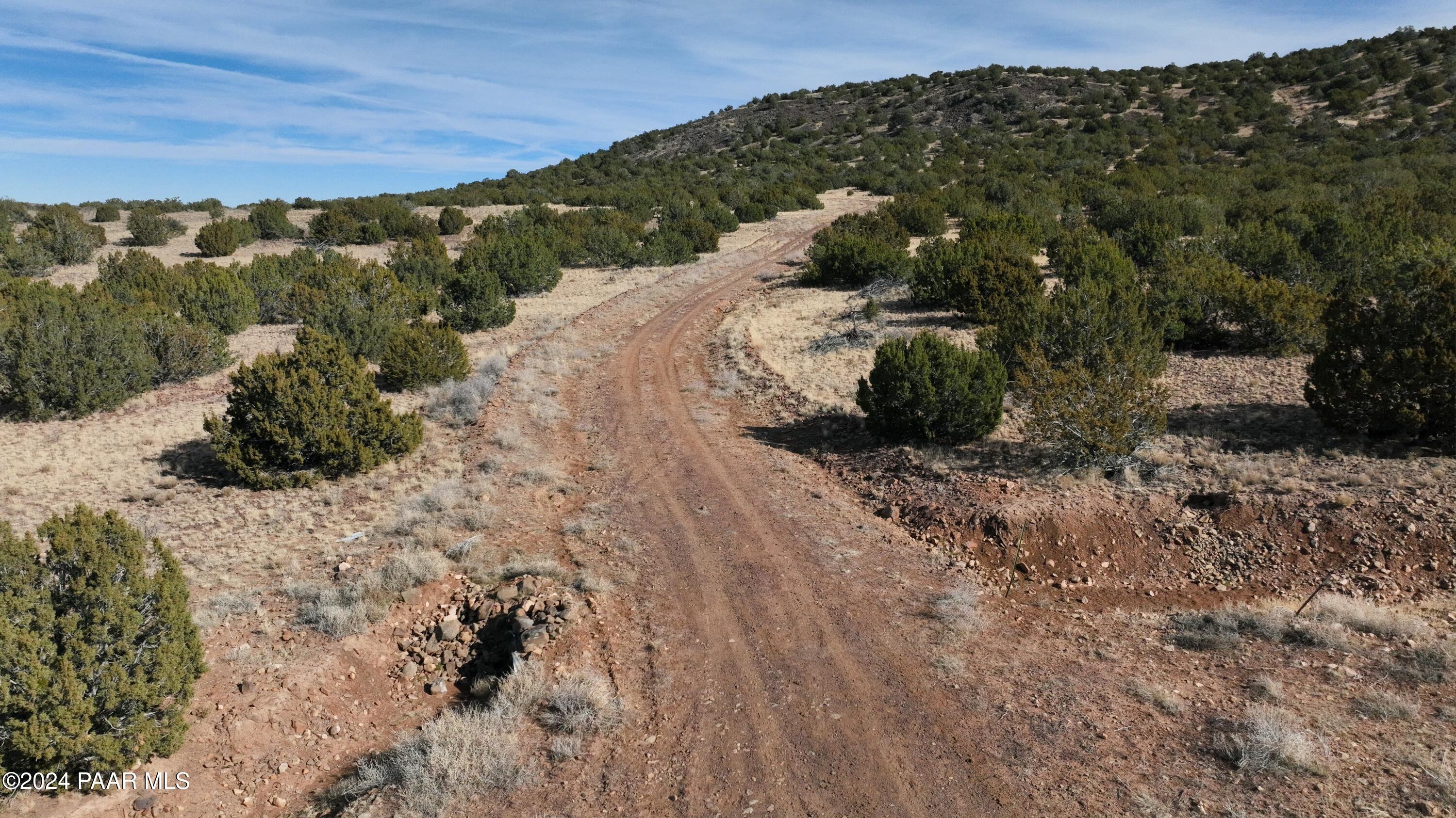 11646 Howard Mesa Loop Williams, AZ 86046 - Photo 12 of 27 a view of a dry yard with wooden fence