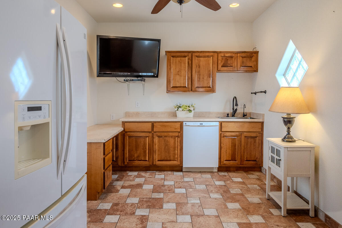 1905 Victoria Farms Road Lake Havasu City, AZ 86404 - Photo 11 of 22 a kitchen with a sink a stove and a microwave