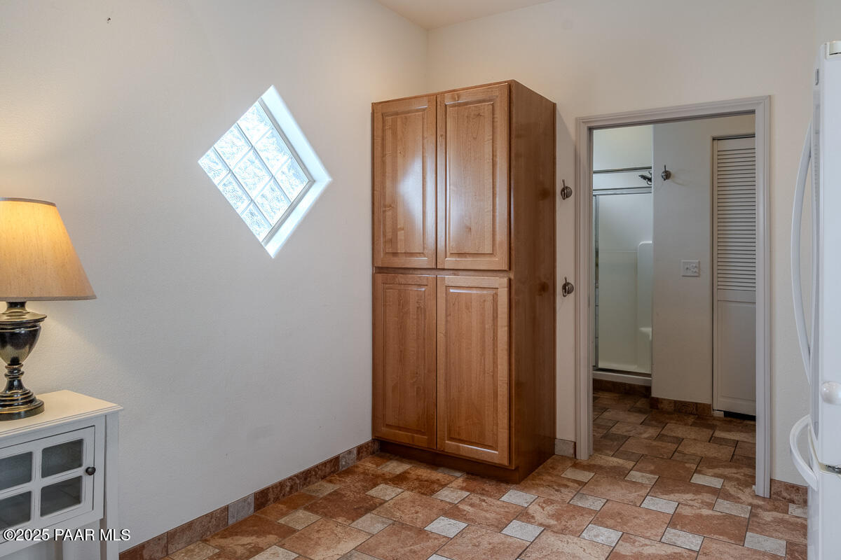 1905 Victoria Farms Road Lake Havasu City, AZ 86404 - Photo 12 of 22 a view of an empty room with wooden floor and a bathroom