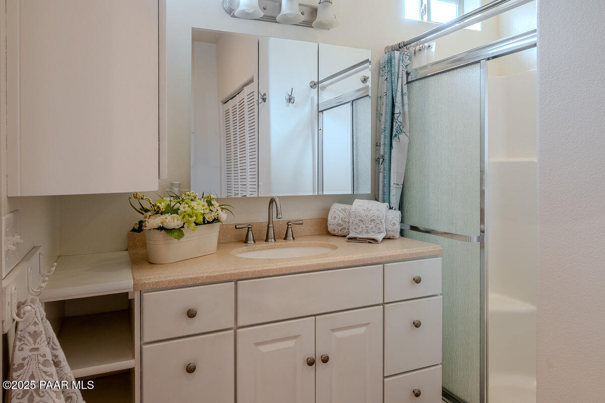 1905 Victoria Farms Road Lake Havasu City, AZ 86404 - Photo 13 of 22 a bathroom with a granite countertop sink vanity granite and shower
