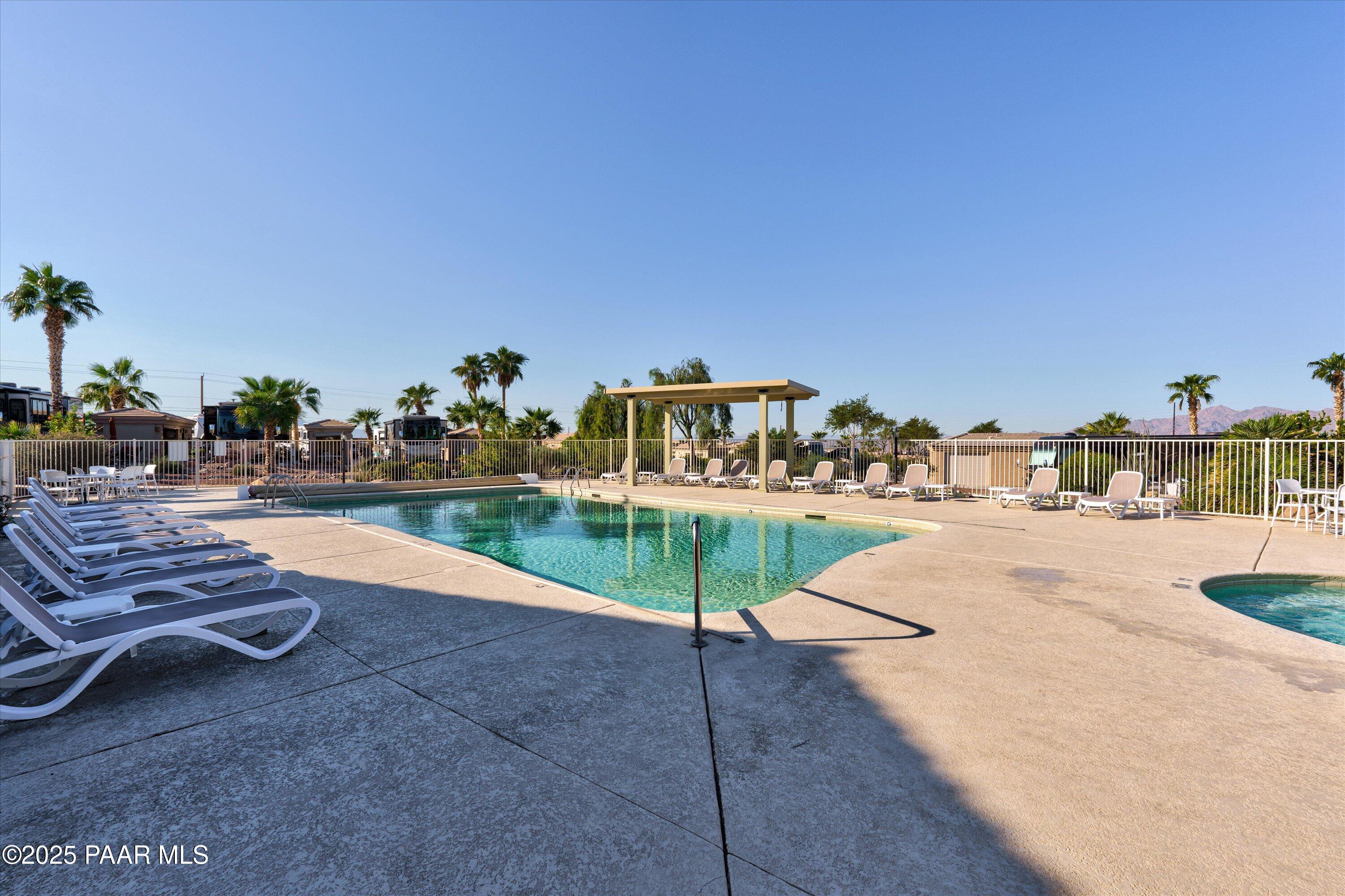1905 Victoria Farms Road Lake Havasu City, AZ 86404 - Photo 22 of 22 a view of swimming pool with outdoor seating and yard in the back
