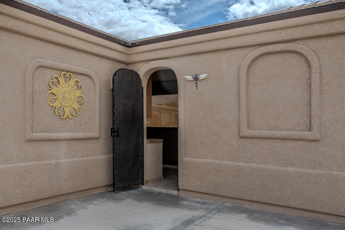1905 Victoria Farms Road Lake Havasu City, AZ 86404 - Photo 4 of 22 a front view of a house with garage