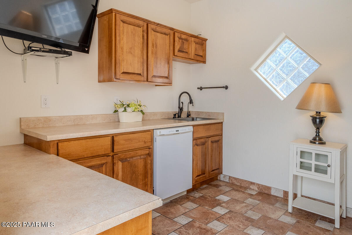 1905 Victoria Farms Road Lake Havasu City, AZ 86404 - Photo 9 of 22 a kitchen with a sink cabinets and a window
