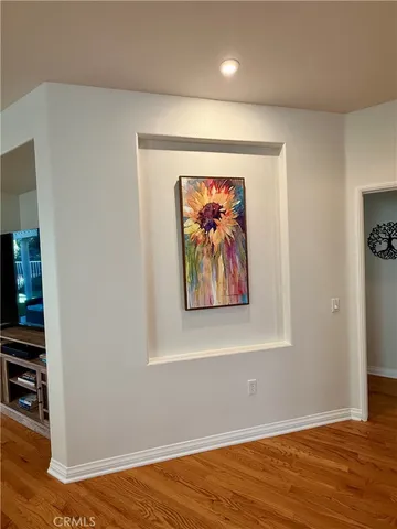 a view of a room with wooden floor and closet