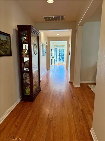 a view of an entryway with wooden floor