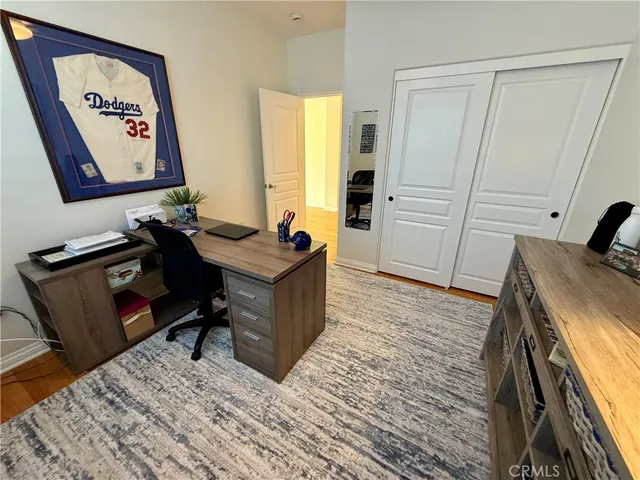 a bed room with a bed and a chair