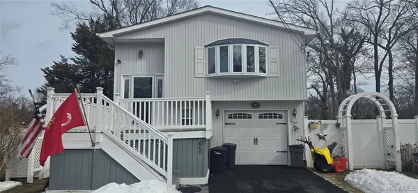a front view of a house with entryway and stairs