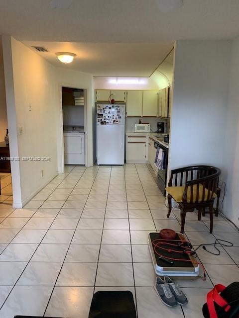 513 Racquet Club Road, Unit 55 Weston, FL 33326 - Photo 8 of 25 a kitchen with stainless steel appliances kitchen island granite countertop a sink and a stove