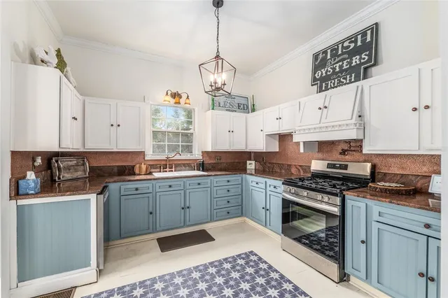 a kitchen with cabinets a sink and appliances