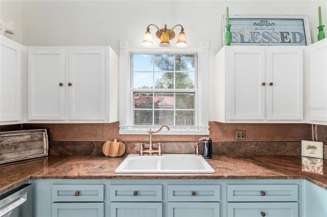 a living room with furniture wooden floor and large window