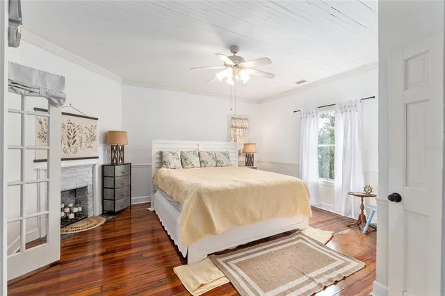 a bathroom with a white tub sink toilet and a window