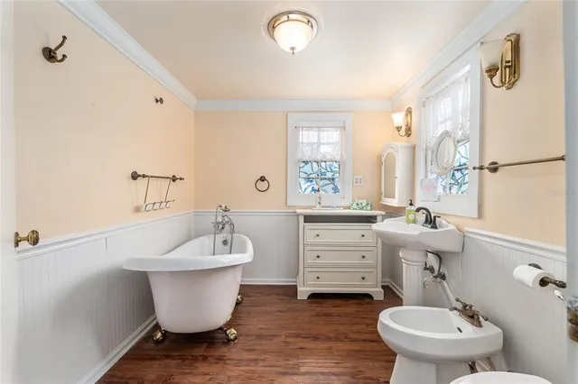 a reading room with furniture and wooden floor