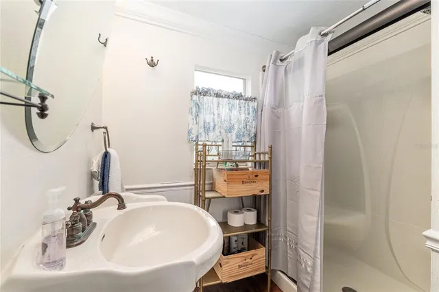 a view of a backyard with a garden and entertaining space