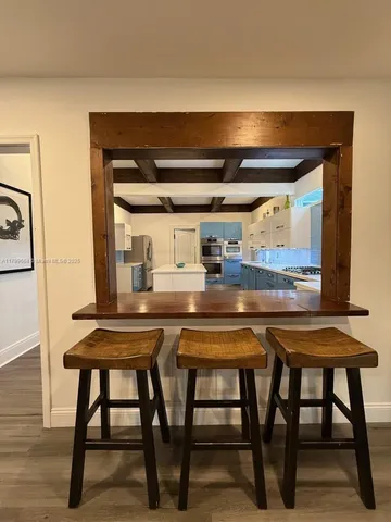 a kitchen with a table and chairs in it