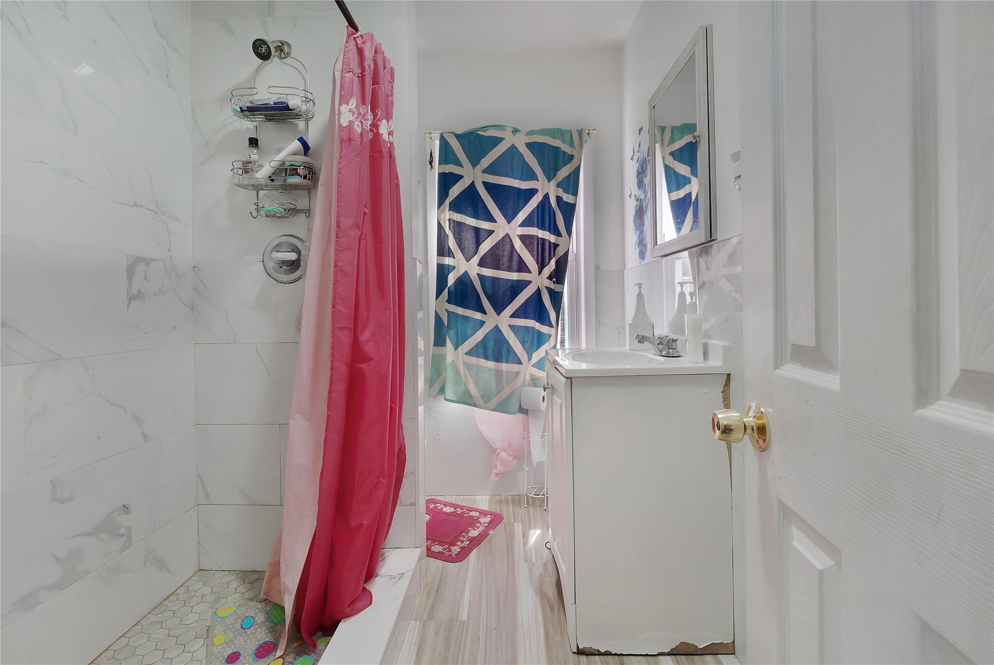 101 Baldwin Road Hempstead, NY 11550 - Photo 14 of 20 Full bathroom with vanity and a shower with shower curtain