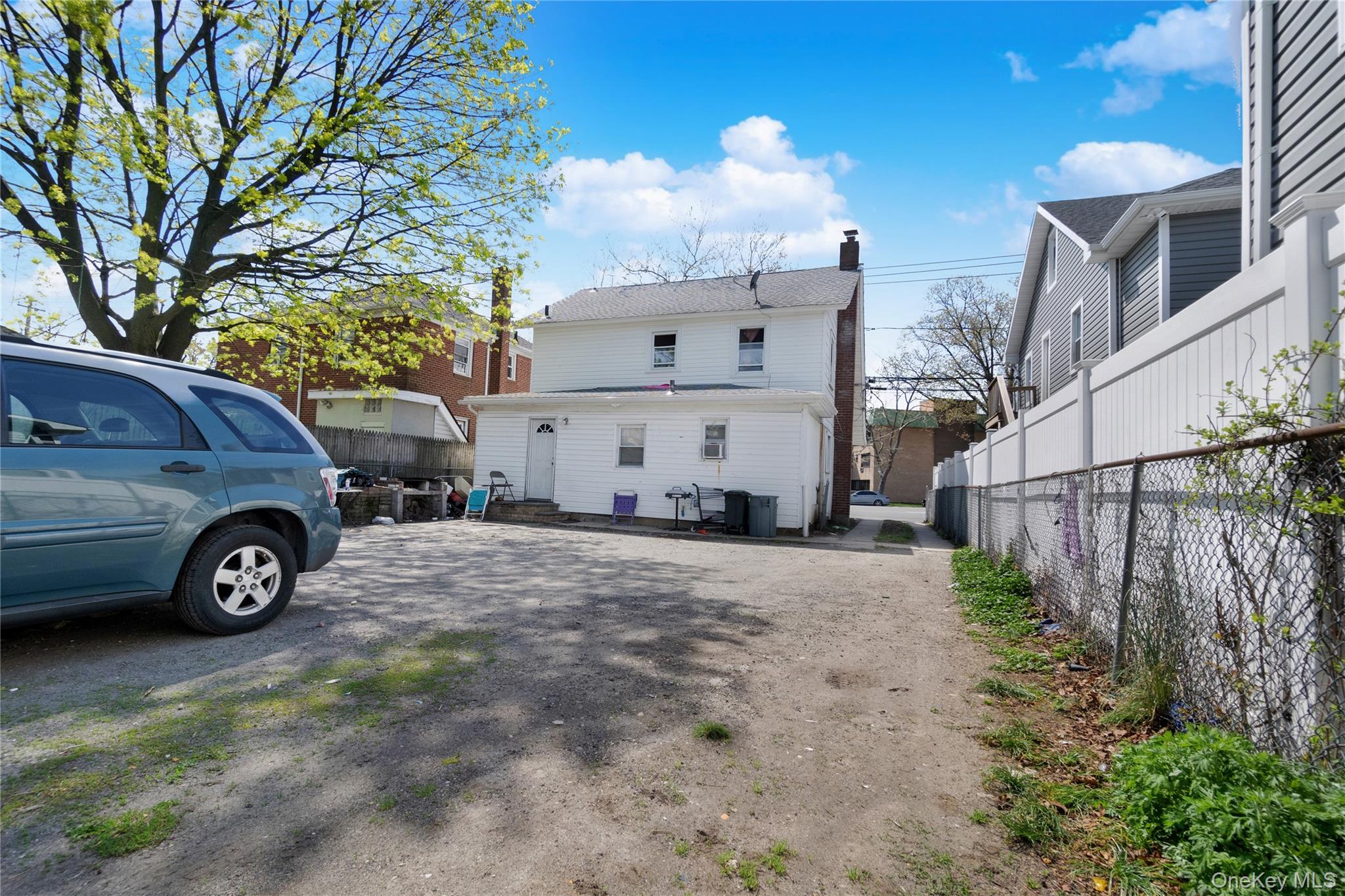 101 Baldwin Road Hempstead, NY 11550 - Photo 16 of 20 Back of house featuring fence and a chimney