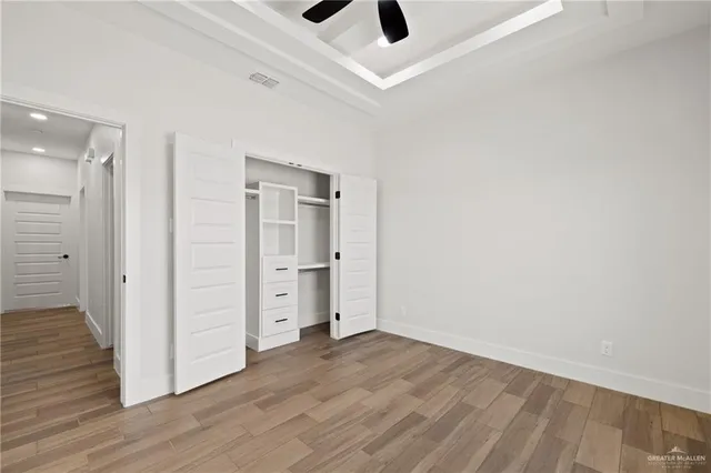 an empty room with wooden floor