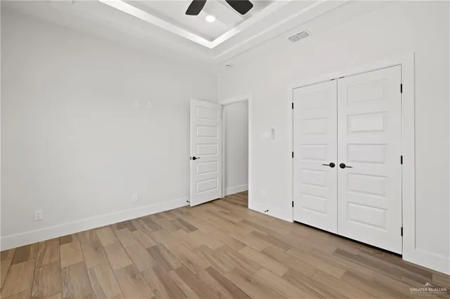 an empty room with wooden floor