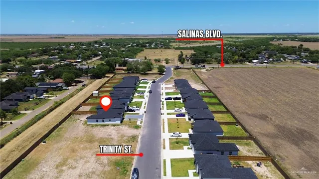 a view of swimming pool with outdoor seating and ocean view