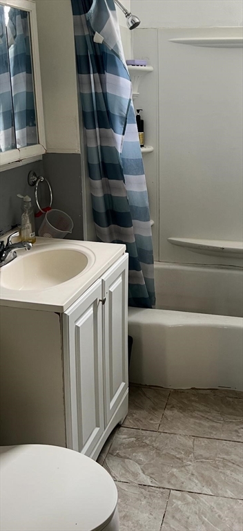71 Fox Street Worcester, MA 01604 - Photo 10 of 21 a bathroom with a sink and toilet