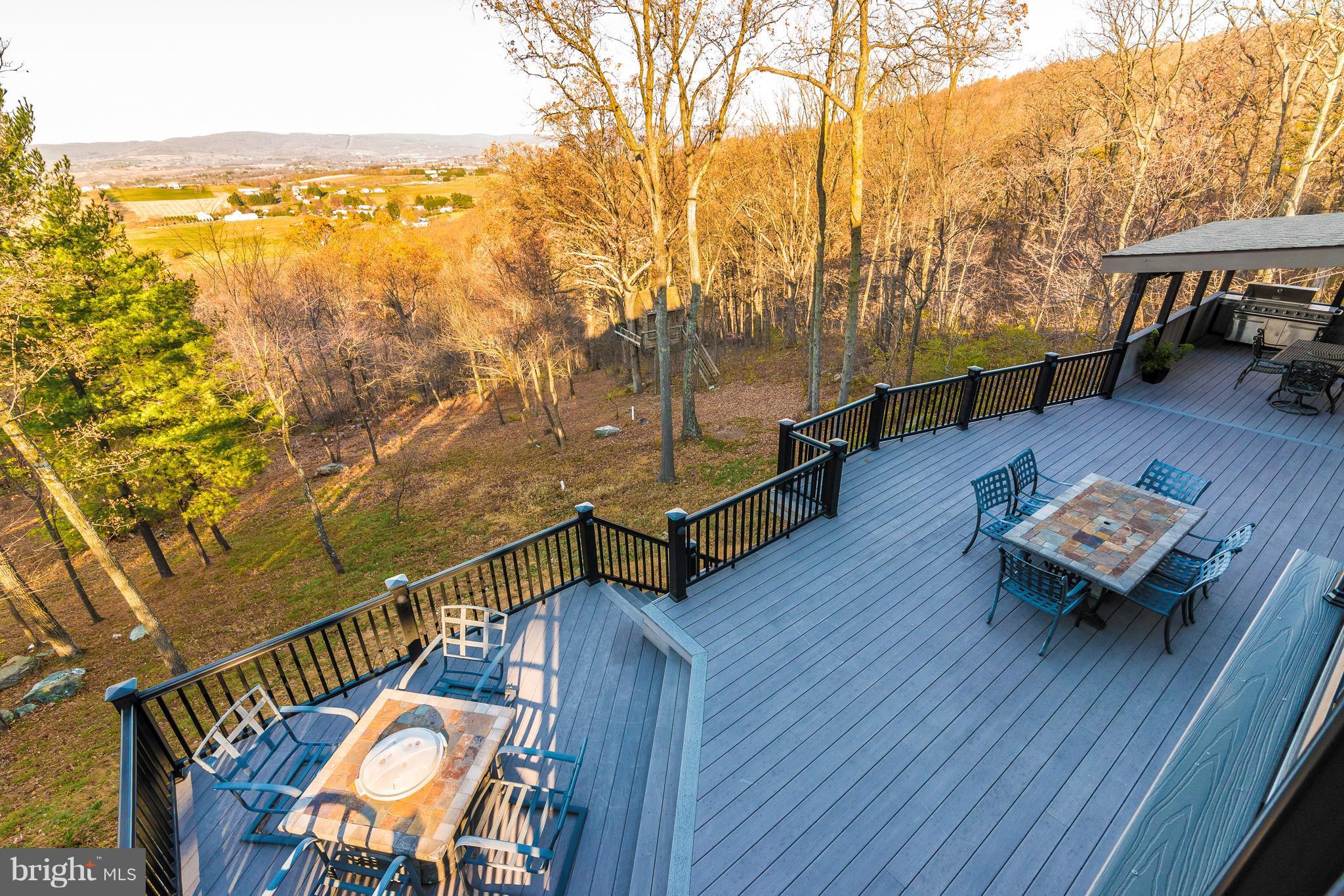 8010 Ridge Road Frederick, MD 21702 - Photo 14 of 30 a balcony with wooden floor and outdoor seating