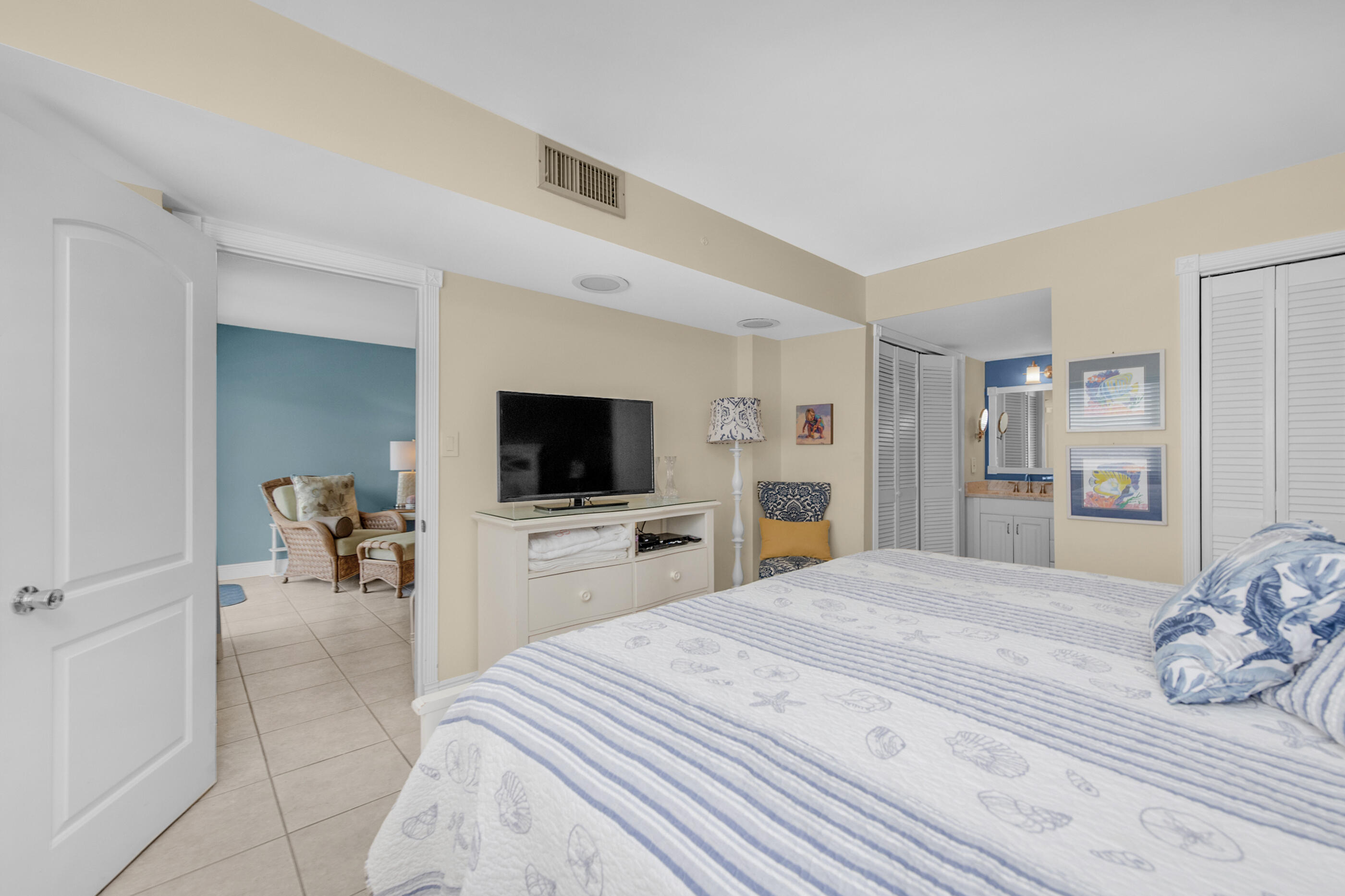 909 Santa Rosa Boulevard, Unit 241 Fort Walton Beach, FL 32548 - Photo 14 of 28 a bedroom with a bed and a flat screen tv