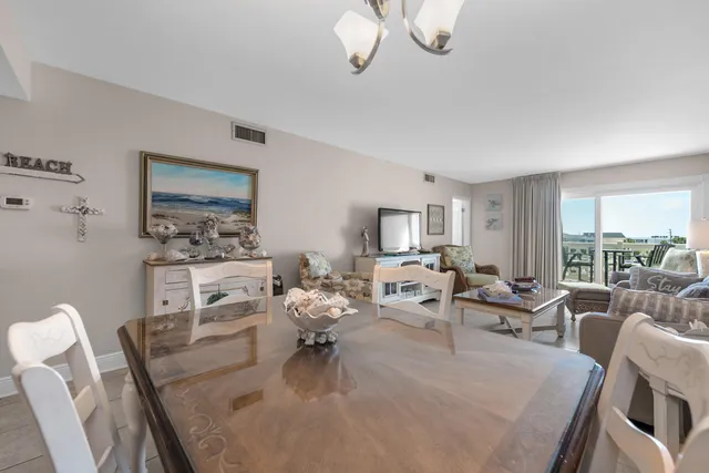 a living room with furniture or couch and a large window