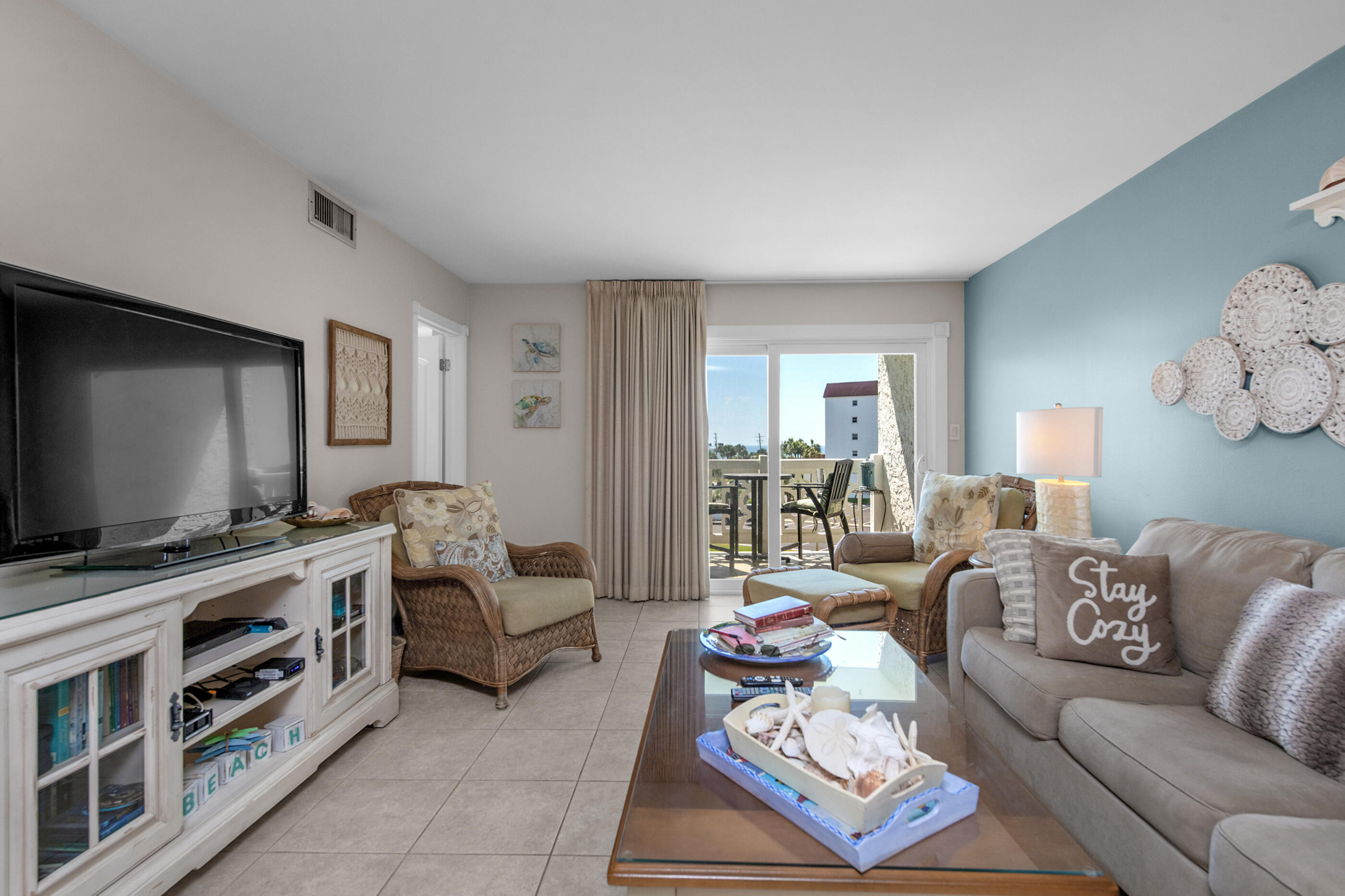 909 Santa Rosa Boulevard, Unit 241 Fort Walton Beach, FL 32548 - Photo 7 of 28 a living room with furniture and a flat screen tv