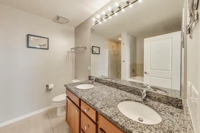 a view of a bedroom with furniture and windows
