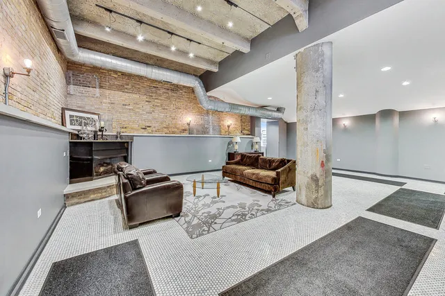 a room with stainless steel appliances lots of white furniture stove top oven and sink