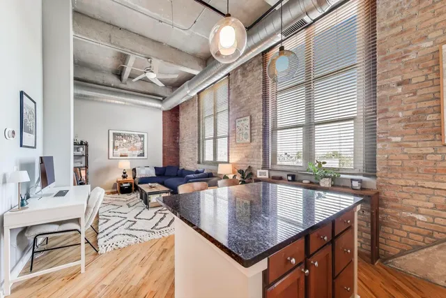 a bedroom with furniture and a flat screen tv