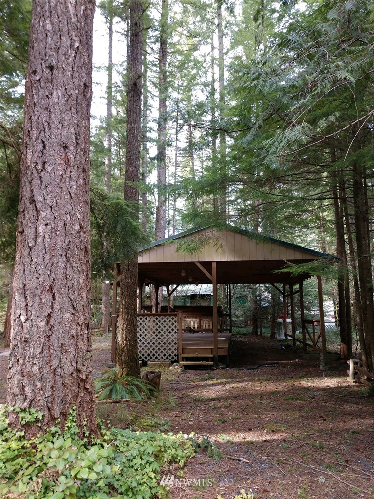 1032 Exit Road, Unit 32 Sumas, WA 98295 - Photo 2 of 12 a view of a table and chairs under an umbrella