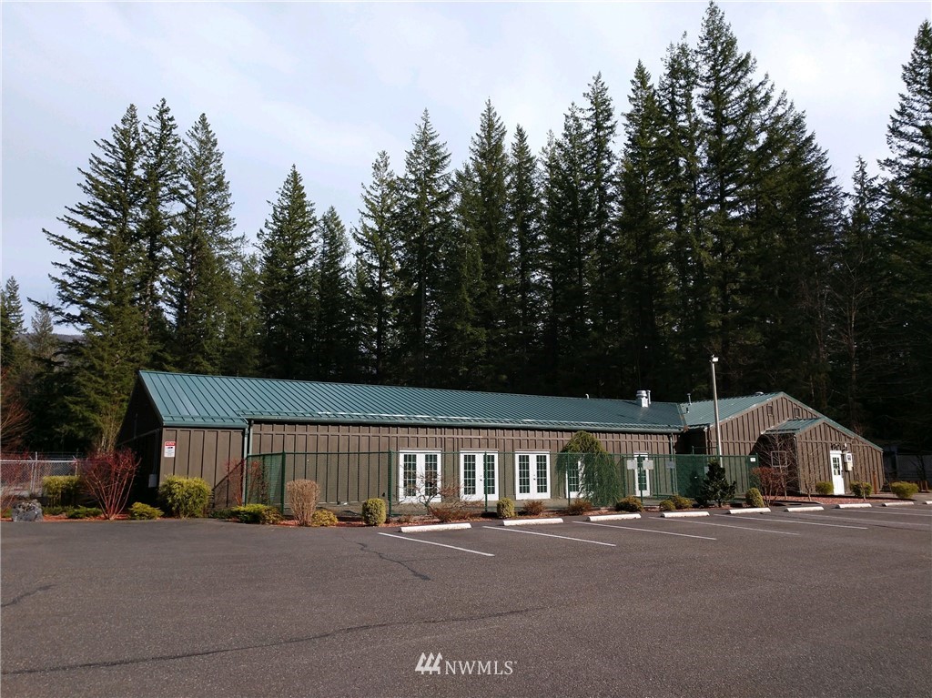 1032 Exit Road, Unit 32 Sumas, WA 98295 - Photo 6 of 12 a front view of a house with a yard and garage