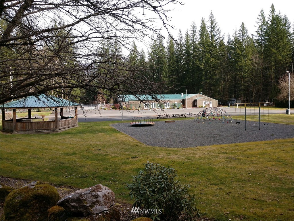 1032 Exit Road, Unit 32 Sumas, WA 98295 - Photo 8 of 12 a view of swimming pool with a yard and seating area