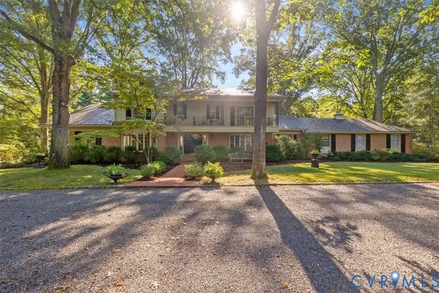 a view of a house with swimming pool and porch with furniture
