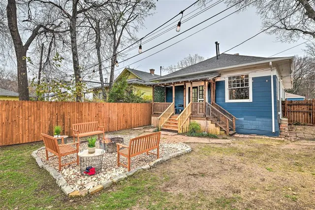 a front view of a house with a bench