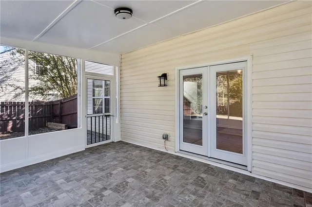 a view of a backyard with large trees