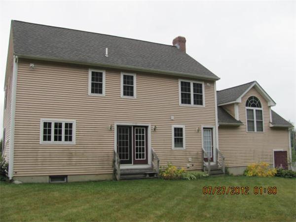 18 Winifreds Way Rutland, MA 01543 - Photo 3 of 13 a front view of a house with a yard