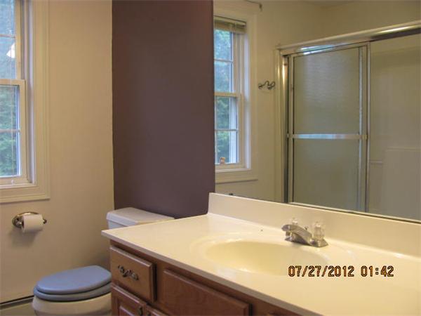 18 Winifreds Way Rutland, MA 01543 - Photo 8 of 13 a bathroom with a sink a toilet and shower