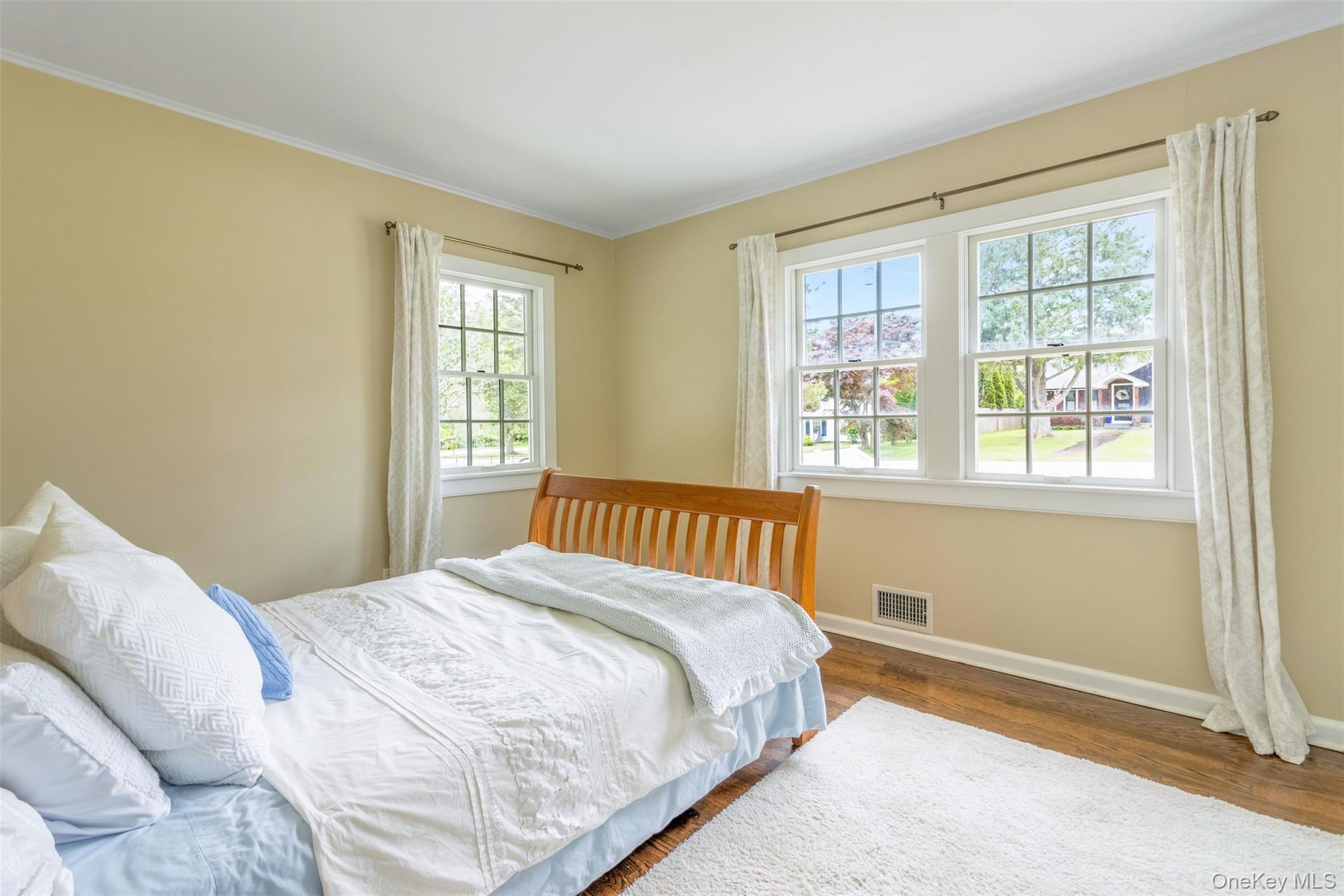 315 Wicks Road New Suffolk, NY 11956 - Photo 15 of 28 a bedroom with a bed and a window