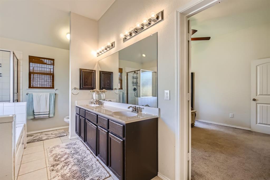 504 Thunder Trail Forney, TX 75126 - Photo 13 of 23 Well-appointed bathroom featuring a double vanity with two rectangular sinks and individual faucets