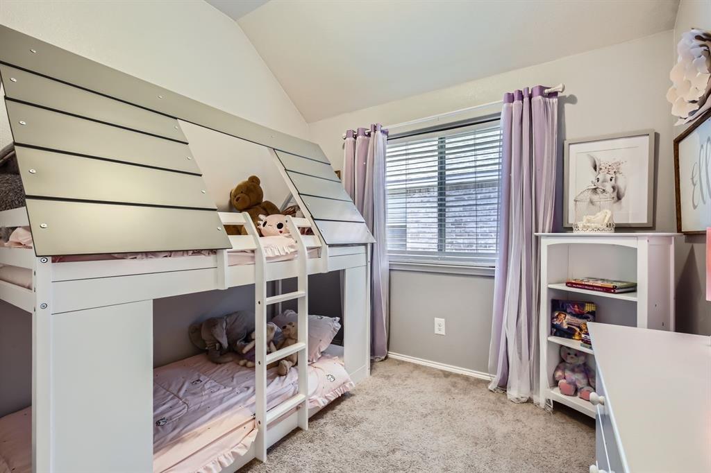 504 Thunder Trail Forney, TX 75126 - Photo 17 of 23 The property features a room with a window, carpeted flooring, and a white and gray bunk bed with a ladder