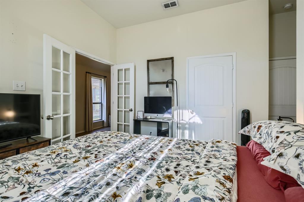 504 Thunder Trail Forney, TX 75126 - Photo 20 of 23 This room features white walls and two sets of white French doors, one with clear panes and another with frosted panes