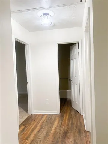a view of a livingroom with wooden floor