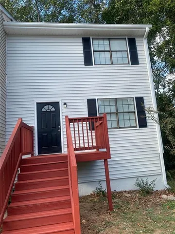 a view of a deck with wooden floor and fence