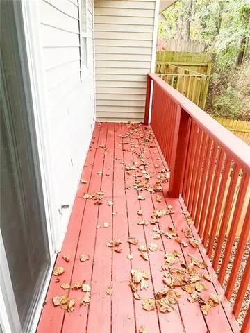 a balcony view with a rug