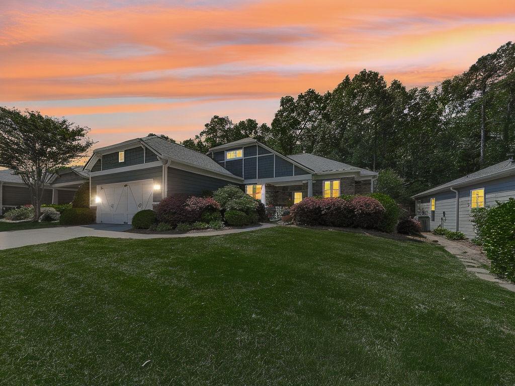 626 Laurel Crossing Canton, GA 30114 - Photo 7 of 77 a front view of house with yard and green space