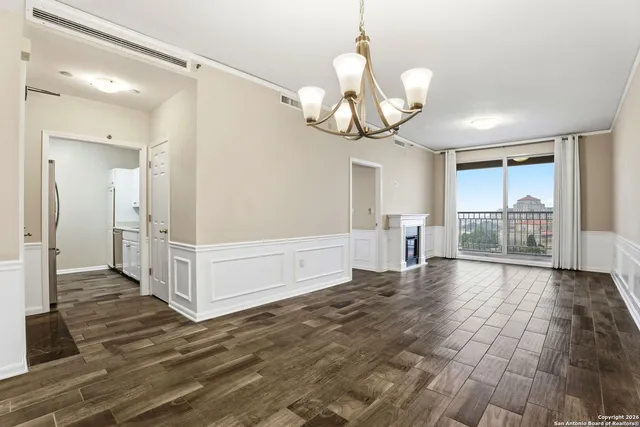 a view of a livingroom with wooden floor