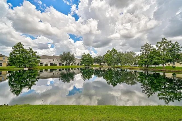 a view of a lake with a big yard