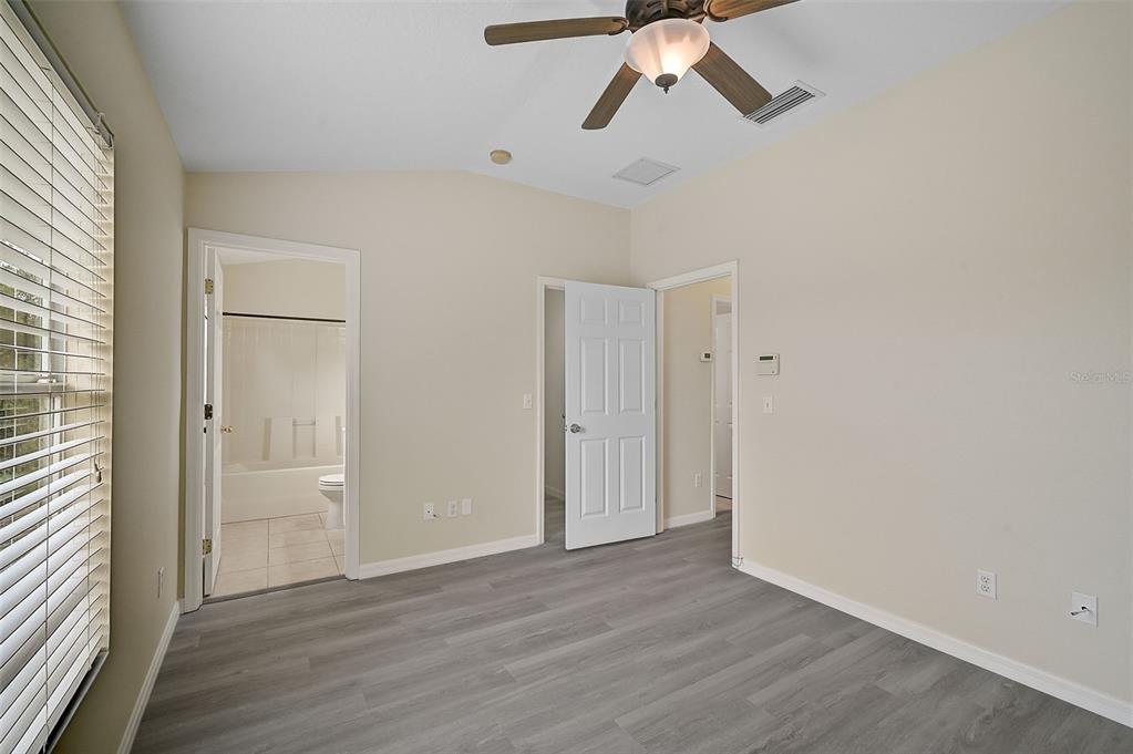 14939 Amberjack Terrace, Unit 102 Lakewood Ranch, FL 34202 - Photo 23 of 34 a view of empty room with wooden floor and fan